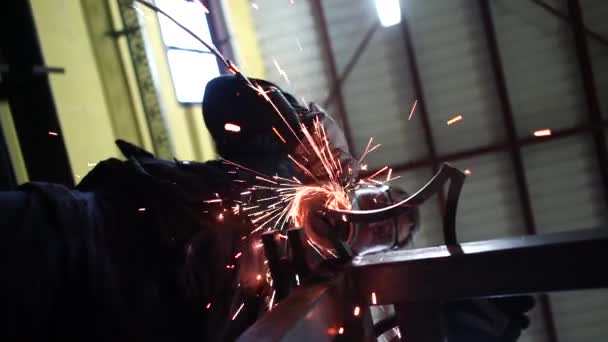 Man Works Grinder Cutting Metal — Stock Video