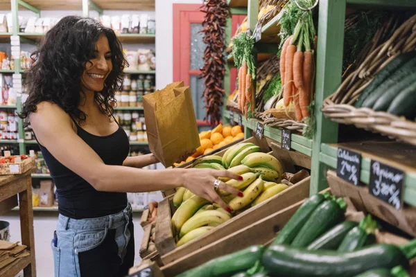 women buying bananas in super market
