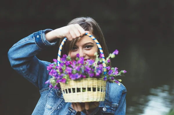 Happy teen girl in the forest with flowers — Stok Foto