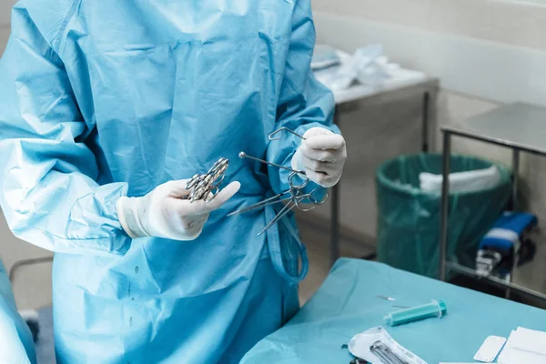 Anonymous nurse preparing equipment for the surgery — 스톡 사진