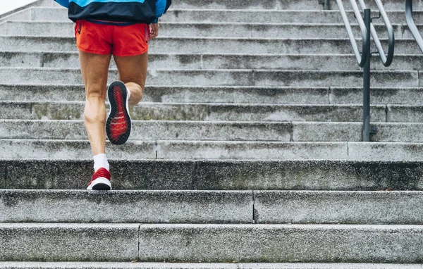 Unrecognizable senior man running up stairs — Stock Photo, Image