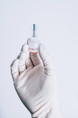 Hand holding a dental implant