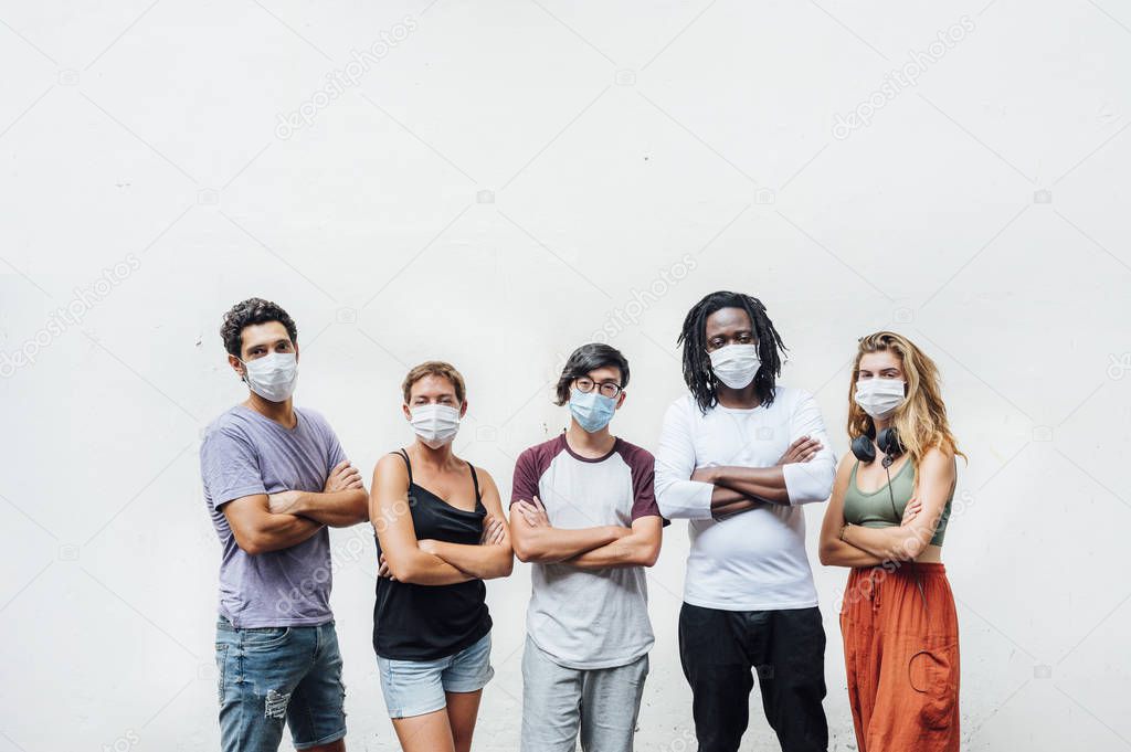 Group of five people with mask in the street