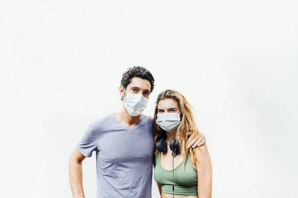 Young couple in the street with mask