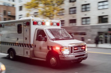 High-speed ambulance on a New York City street clipart