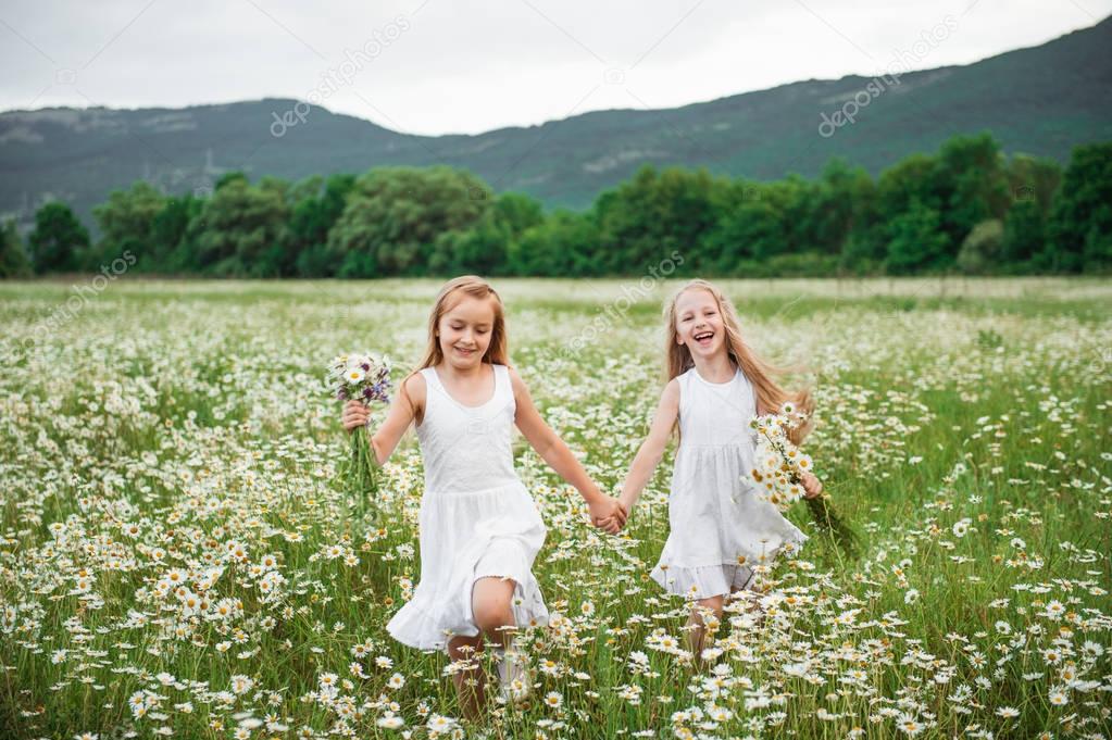  children girls running in a field