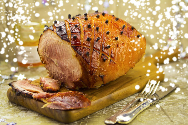 Christmas roasted ham with apricot glaze and cloves