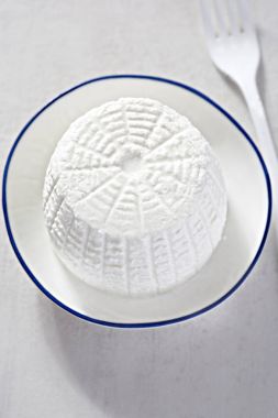 Ricotta cheese on white plate  clipart