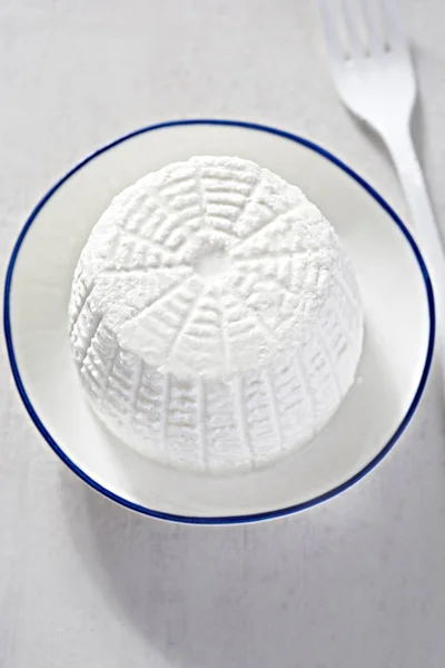 Ricotta cheese on white plate — Stock Photo, Image