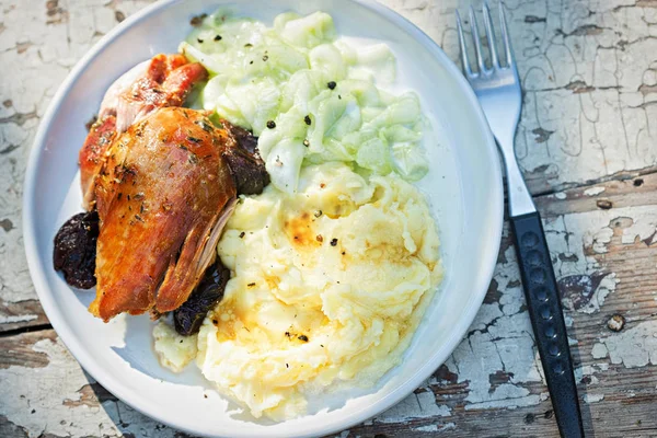 Roasted turkey breast with dried plums, mashed potatoes and cucumber salad — Stock Photo, Image