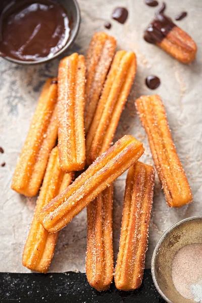 Churros with sugar and chocolate sauce — Stock Photo, Image