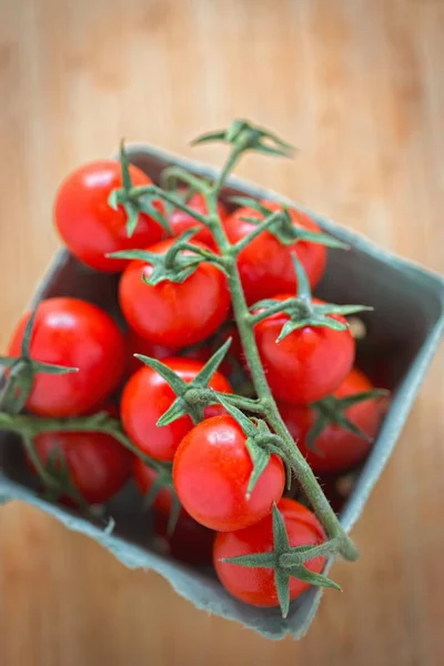 Tomatoes on the vine in the box