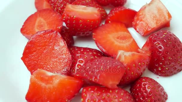 Sliced Red Ripe Juicy Fresh Strawberry On A White Plate — Stock Video