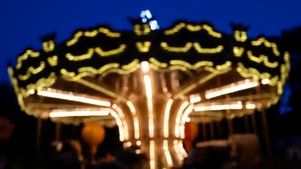 Bokeh licht gloeiende carrousel — Stockvideo