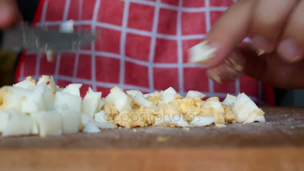 Crumble the chicken boiled egg in kitchen — Stock Video