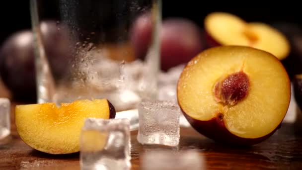 Cut Slice Ripe Plum on Wooden Surface with Ice