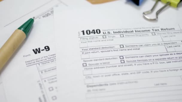 Binder Clips with Pen on W-9 and 1040 Tax Form — 비디오