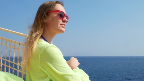 Young woman on beach on sea coast — Stock video