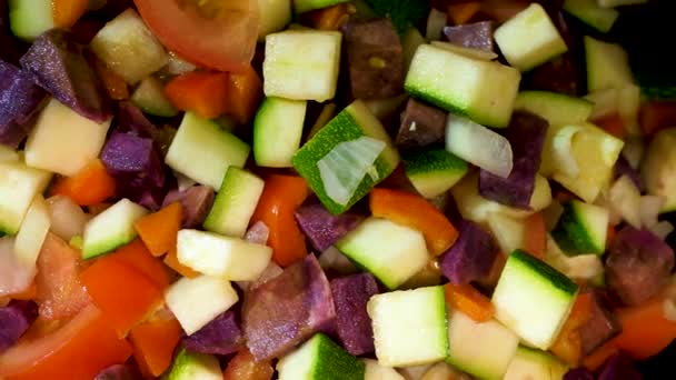 Stewed sliced vegetables in pan — Stockvideo