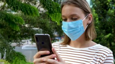 Adult female in blue protective face mask