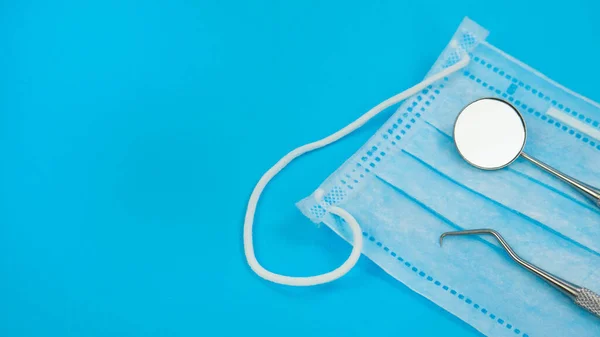 Sterile Professional Medical Instruments For Dentist Check Up With Blue Background