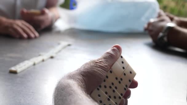 Unrecognizable seniors Hands Playing Game of Dominoes — Stock Video