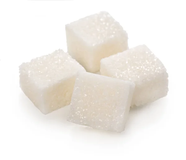 Cubos de azúcar en terrones aislados sobre un fondo blanco . — Foto de Stock