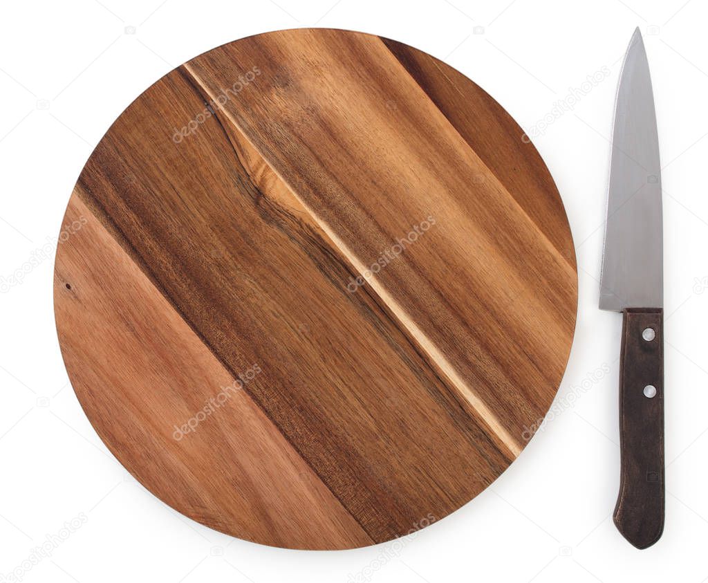 Chef knife near a round cutting board made from acacia wood isol