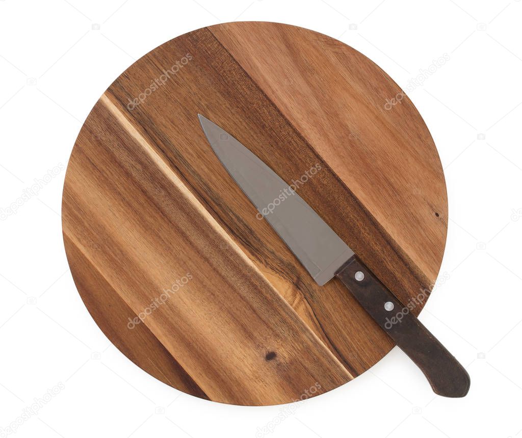 Chef knife on a round cutting board made from acacia wood isolat