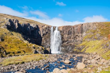 Waterfall gufufoss in river Fjardara in Seydisfjordur in east Iceland