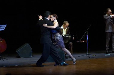 DNIPROPETROVSK, UKRAINE  NOVEMBER 4: The dancers Ruben & Sabrina Veliz (Argentina, Buenos Aires) at World Stars Tango show on November 4, 2011 in Dnipropetrovsk, Ukraine clipart