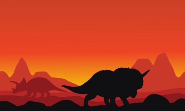 Dinozor triceratops dağ arka planlar ile silüeti