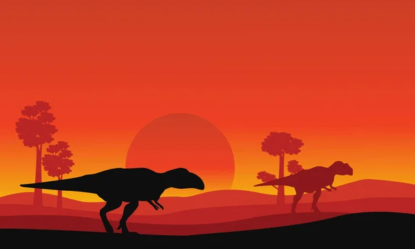 Mapusaurus オレンジ色の空の風景のシルエット — ストックベクタ