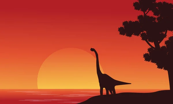 Silhouette de dinosaure brachiosaure sur la rive — Image vectorielle