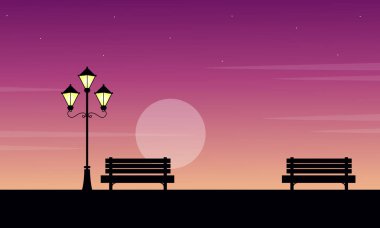 Gündoğumu sandalye manzara ile sokak lambası