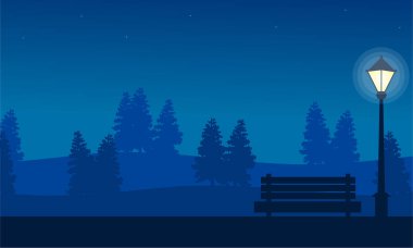 Sandalye bahçesinde gece lambalı silüeti