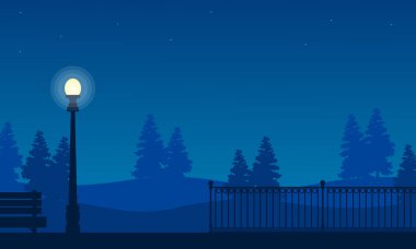 Sokak lambası manzara ile bahçe çit silüeti