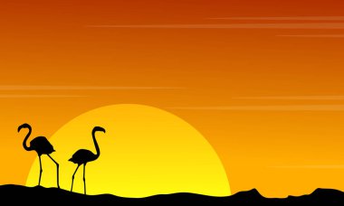 Flamingo üzerinde turuncu gökyüzü manzara siluet