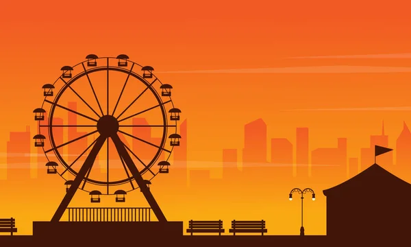 Parque de atracciones paisaje al atardecer — Vector de stock