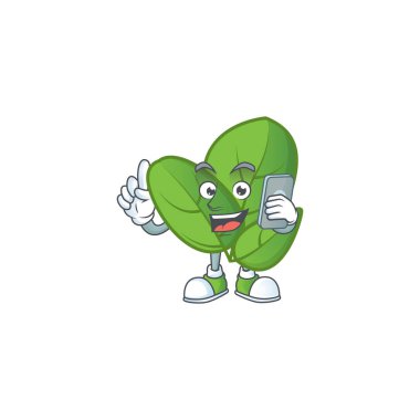 Fesleğenin maskot tasarımı telefonda konuşuyor.