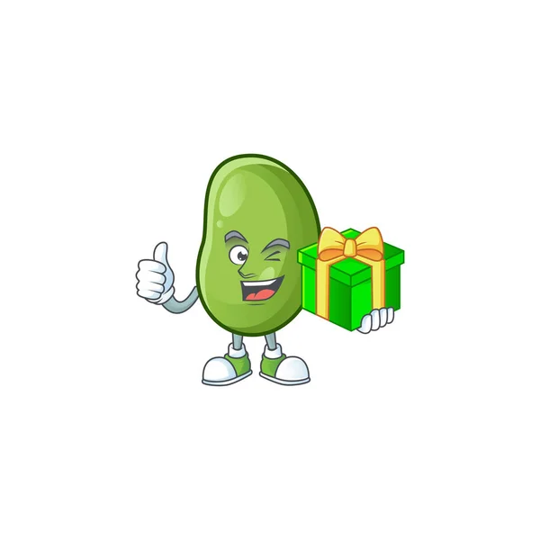 Karakter kartun dari kacang hijau bahagia dengan kotak hadiah - Stok Vektor