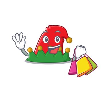 Neşeli elf şapkalı çizgi film karakteri el sallıyor ve alışveriş çantası tutuyor.