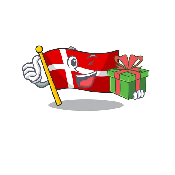 Mascot cartoon of happy flag denmark with gift box — 스톡 벡터