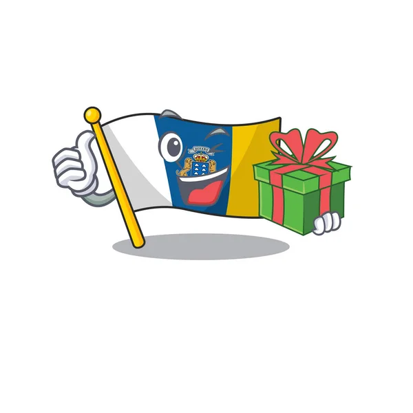 Glückliches Gesicht Flagge Kanarieninsel Schriftrolle Charakter mit Geschenkbox — Stockvektor