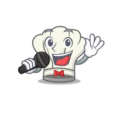 Mutlu aşçı şapkası mikrofonda şarkı söylüyor