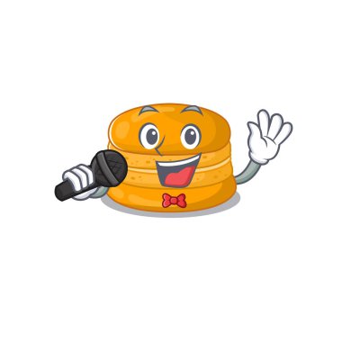 Cute orange macaron sings a song with a microphone