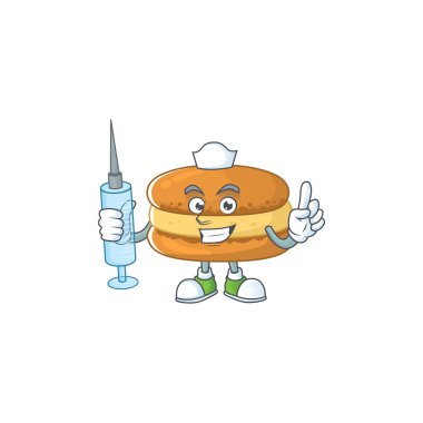 Çikolatalı badem kurabiyesinin hoş bir hemşiresi şırınga kullanarak maskot tasarımı yapıyor.