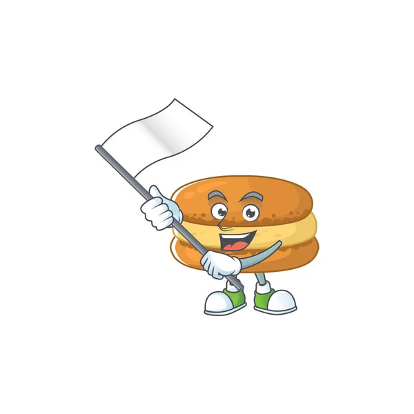 Um patriótico macarons de chocolate mascote design personagem segurando bandeira de pé — Vetor de Stock