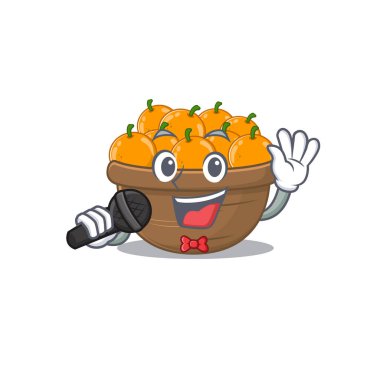 Şirin turuncu meyve sepeti mikrofonla şarkı söylüyor.