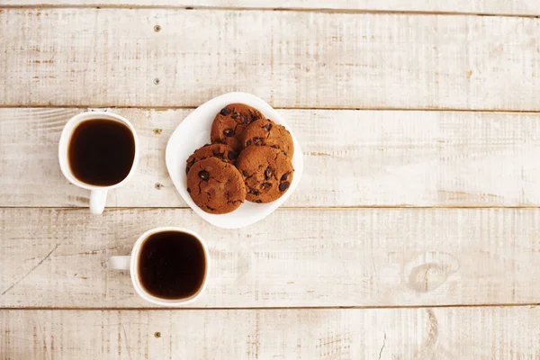 Cups of coffee and cookies — Stock Photo, Image